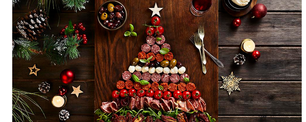 A Charcuterie board in the shape of a Christmas tree